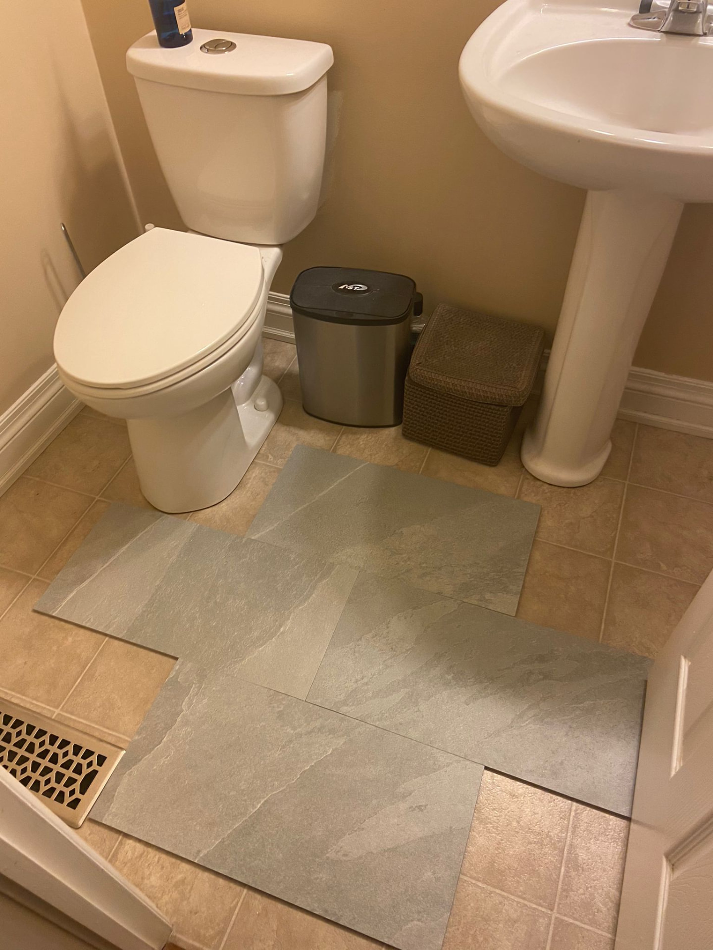 Slate-look floor tile dry-laid in an Ottawa bathroom before installation